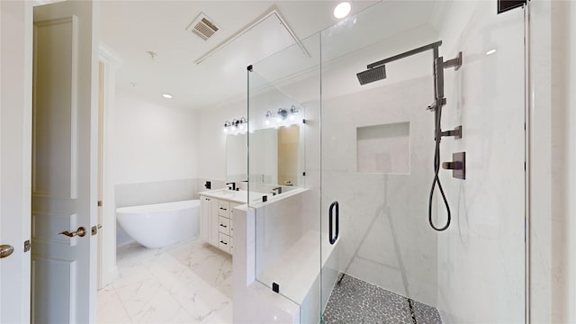 bathroom featuring vanity and shower with separate bathtub