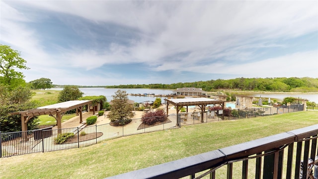 exterior space with a water view and a pergola