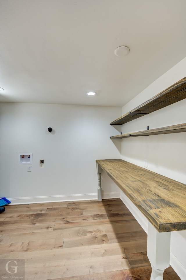 laundry room featuring light hardwood / wood-style floors, electric dryer hookup, and hookup for a washing machine