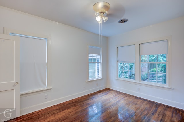 unfurnished room featuring ceiling fan and dark hardwood / wood-style floors