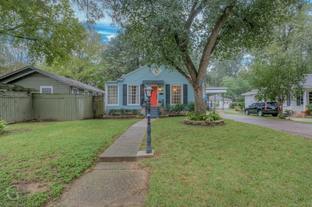 view of front of property with a garage and a front yard