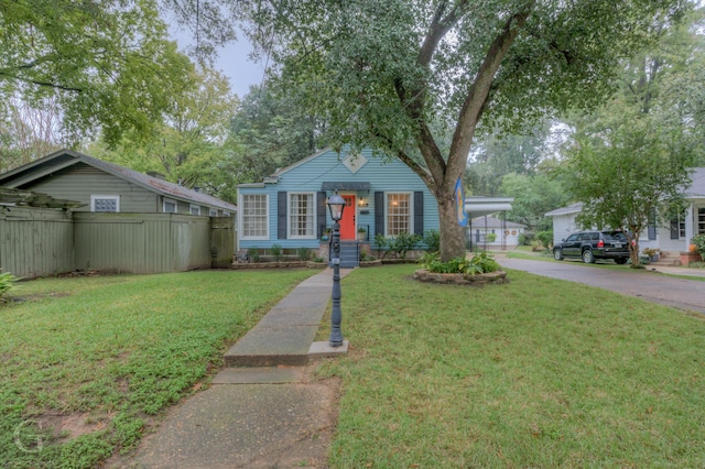 view of front facade with a garage and a front yard