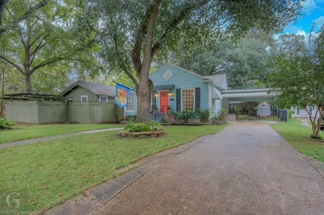 view of front of house with a front lawn and a carport