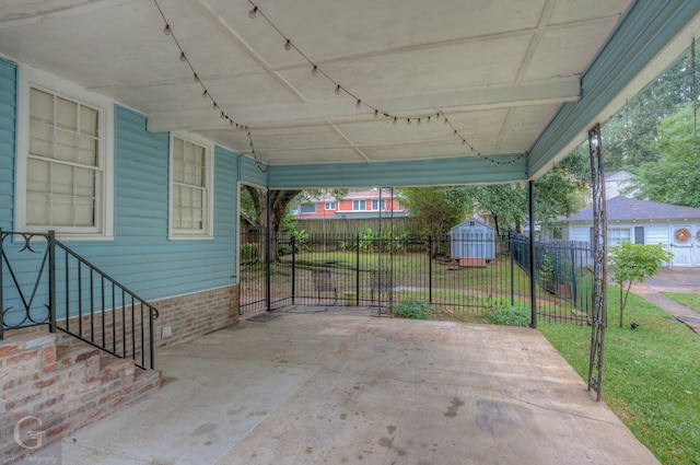 view of patio featuring a storage shed