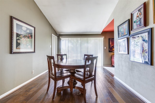 dining room with dark hardwood / wood-style floors