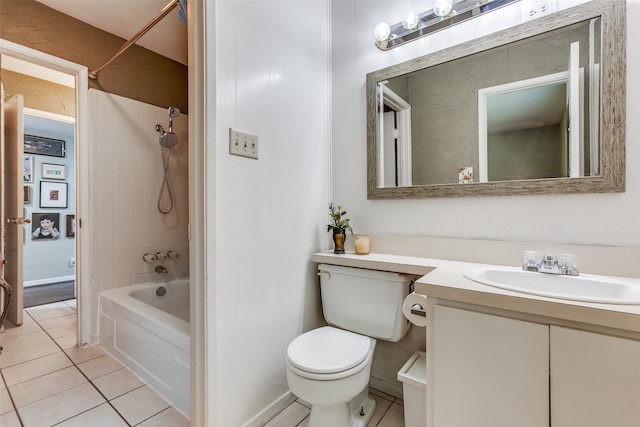 full bathroom featuring tile patterned flooring, vanity, tiled shower / bath combo, and toilet