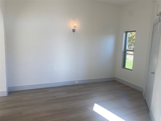 interior space with ceiling fan and dark hardwood / wood-style flooring