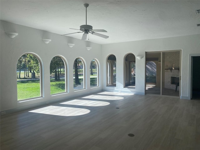 unfurnished living room featuring dark hardwood / wood-style floors