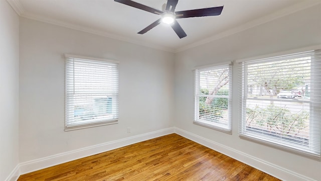 unfurnished room with ceiling fan, hardwood / wood-style floors, and ornamental molding