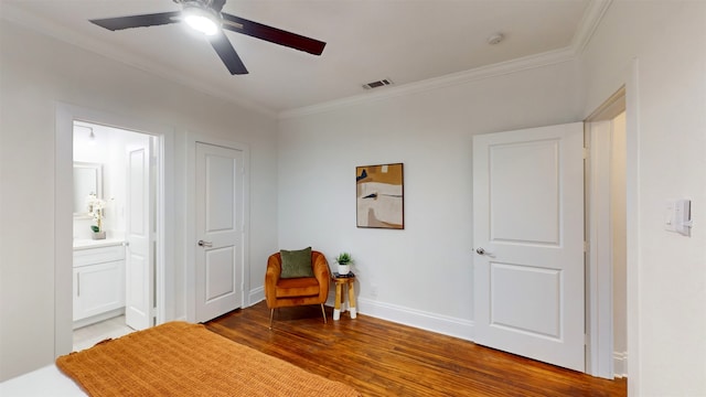 living area with wood-type flooring, ceiling fan, and crown molding