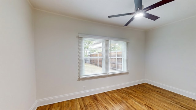 spare room with ornamental molding, ceiling fan, and light hardwood / wood-style floors