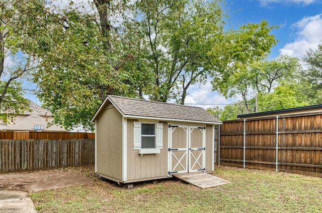 view of outbuilding with a lawn