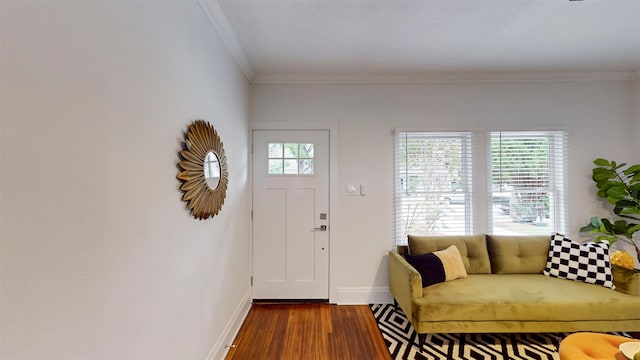 entryway featuring dark wood-type flooring and crown molding