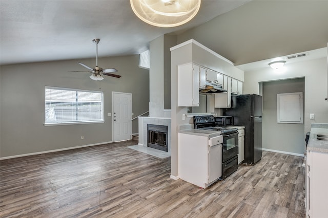 kitchen with ceiling fan, white cabinetry, black appliances, and light hardwood / wood-style flooring