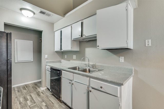 kitchen featuring white cabinetry, light wood-type flooring, sink, and black appliances