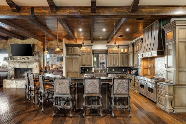 kitchen featuring decorative light fixtures, a center island, double oven range, dark hardwood / wood-style flooring, and custom range hood