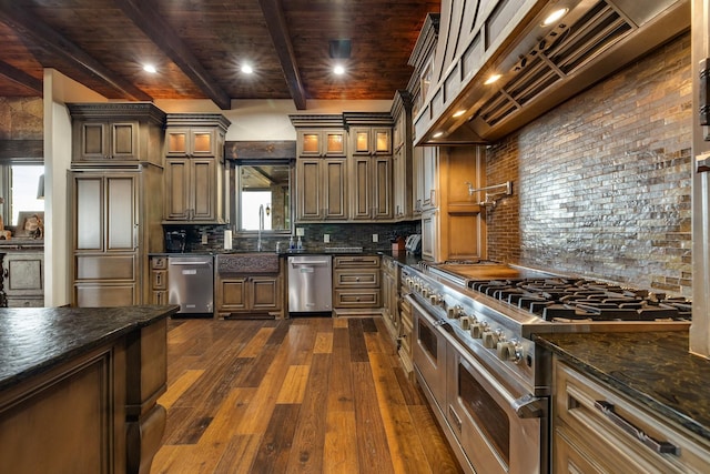 kitchen with dark stone countertops, backsplash, high end appliances, dark hardwood / wood-style flooring, and beamed ceiling