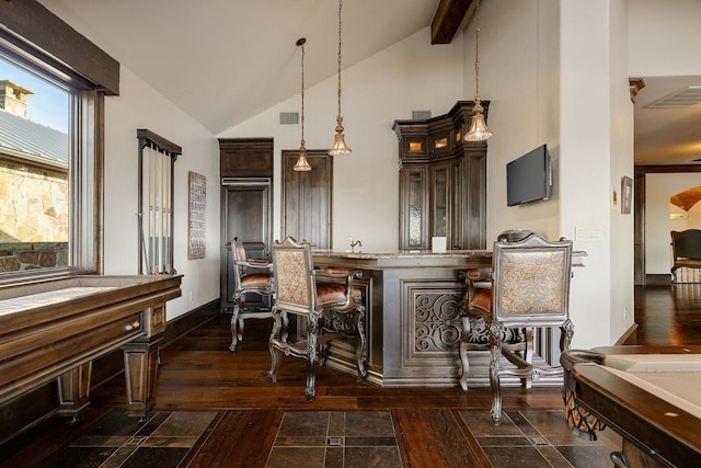 kitchen featuring high vaulted ceiling, hanging light fixtures, dark wood-type flooring, dark brown cabinets, and beam ceiling