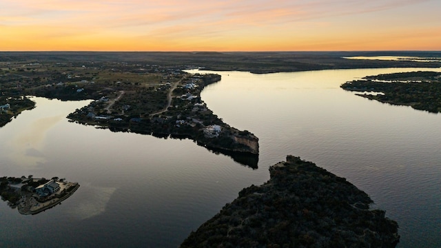 aerial view at dusk with a water view