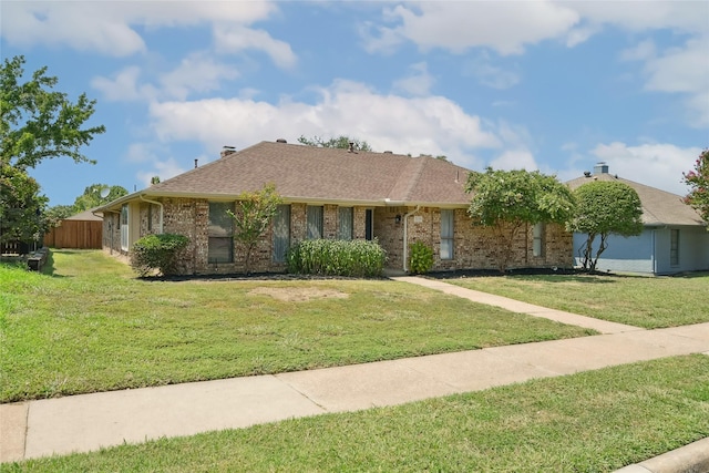 ranch-style house featuring a front yard