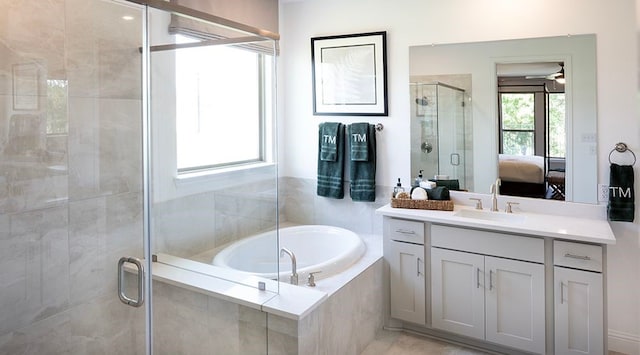 bathroom featuring vanity and plus walk in shower