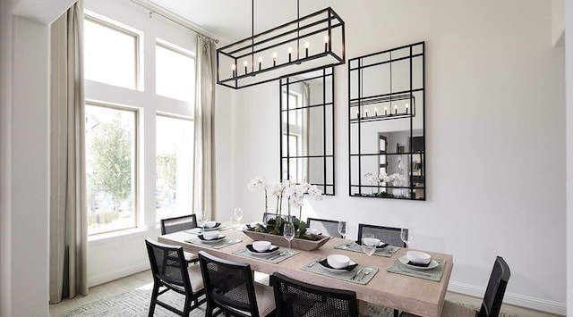 dining space featuring a wealth of natural light and light hardwood / wood-style floors