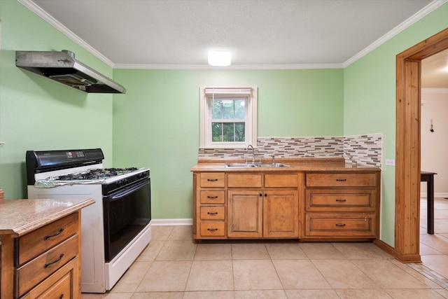 kitchen featuring white range with gas stovetop, tasteful backsplash, sink, and crown molding