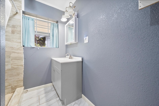 bathroom with a shower and vanity