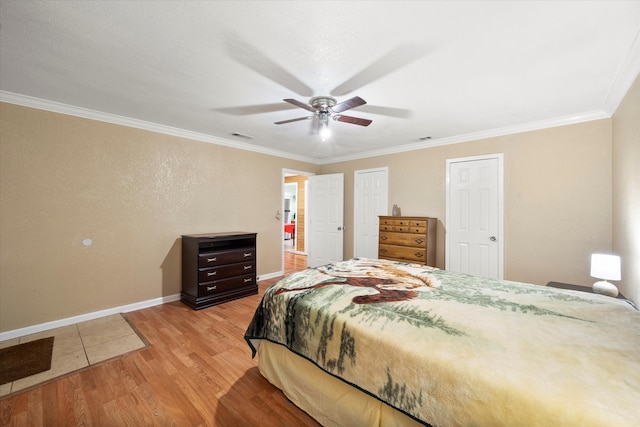 bedroom with ceiling fan, light hardwood / wood-style flooring, and ornamental molding