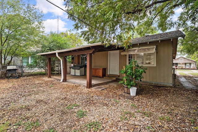 rear view of house with an outbuilding