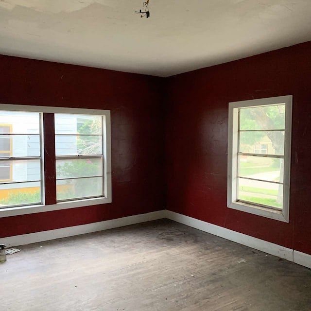 empty room with hardwood / wood-style floors