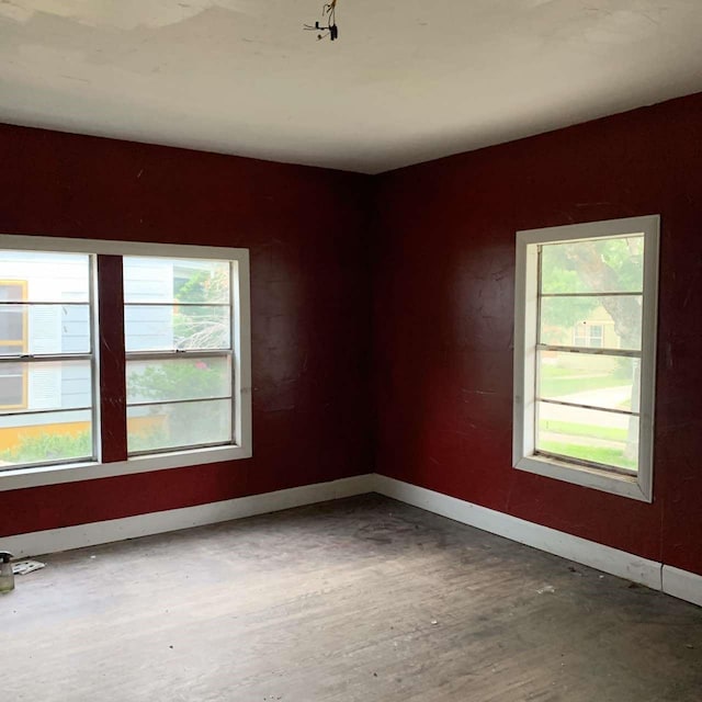 empty room with hardwood / wood-style flooring