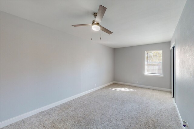 2605 Mark Dr, Mesquite, TX 75150 - spare room featuring light colored carpet, baseboards, and ceiling fan
