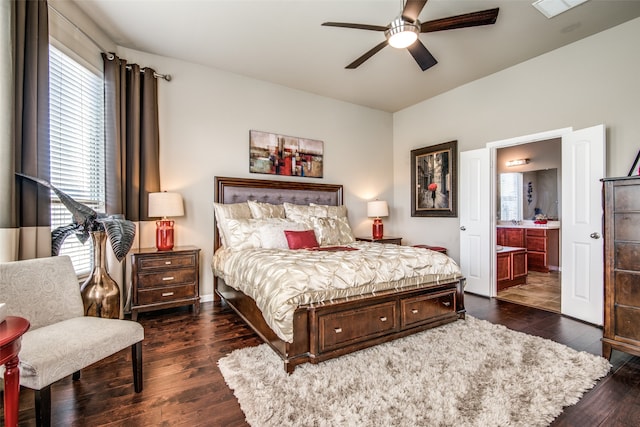 bedroom with ceiling fan, multiple windows, dark hardwood / wood-style floors, and ensuite bathroom