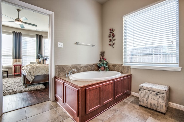 812 Green Coral Dr, Little Elm, TX 75068 - full bath featuring a garden tub, plenty of natural light, a ceiling fan, and tile patterned floors