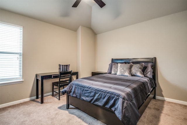 bedroom with carpet floors, multiple windows, ceiling fan, and lofted ceiling