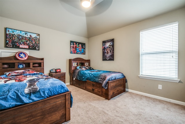 bedroom featuring ceiling fan and light carpet