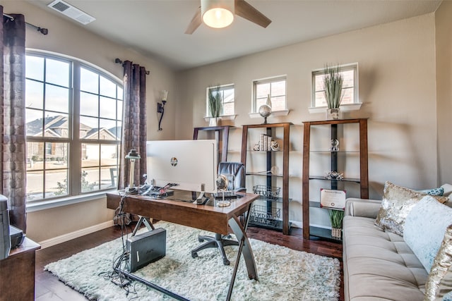 office with wood-type flooring and ceiling fan