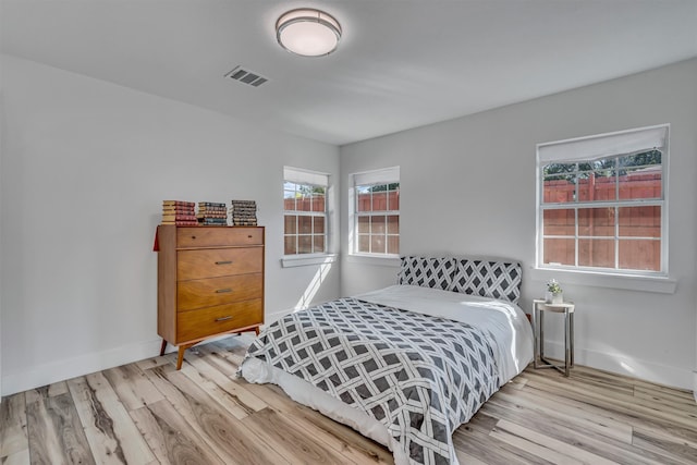 bedroom with light wood-type flooring