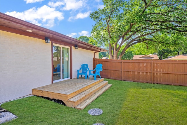 view of yard with a wooden deck