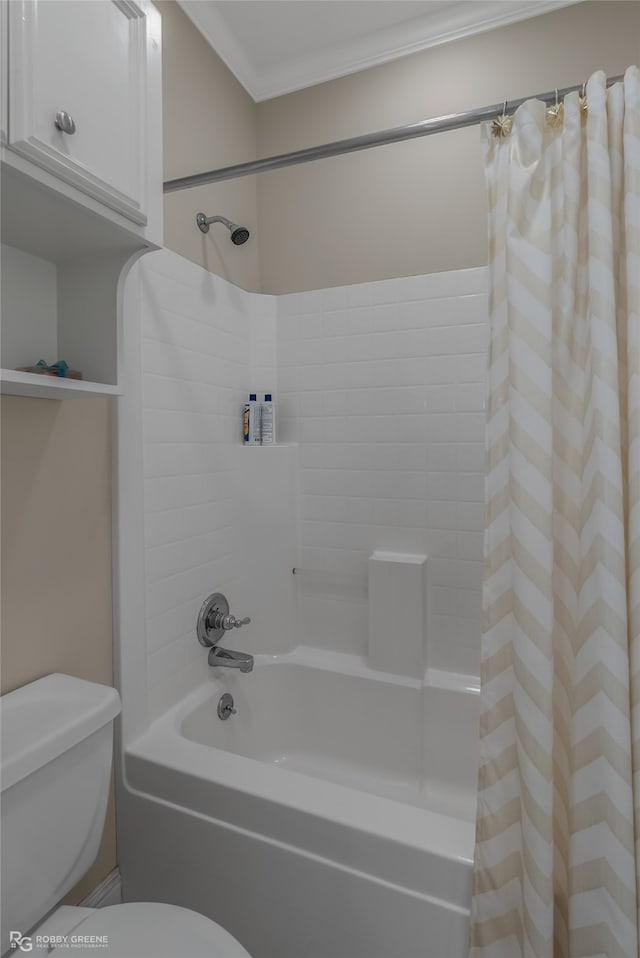 bathroom featuring ornamental molding, shower / tub combo with curtain, and toilet