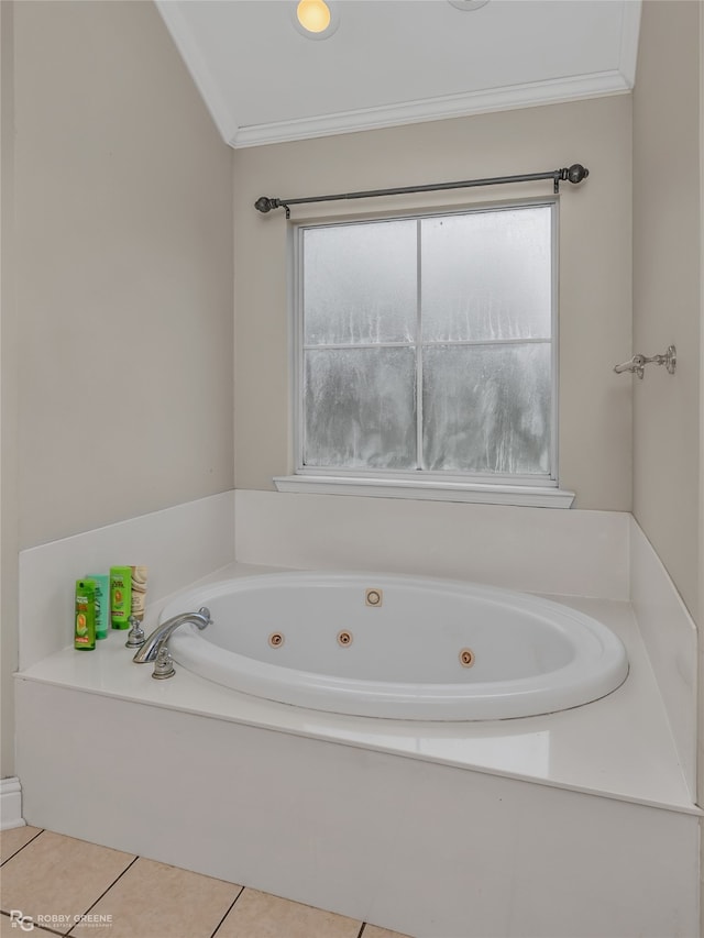 bathroom with a bath, tile patterned floors, and crown molding