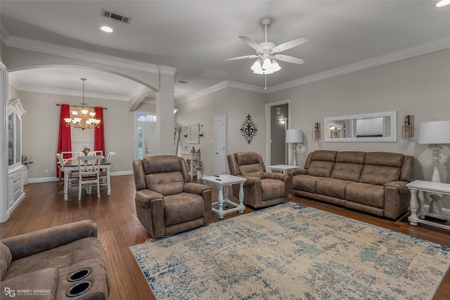 living room with crown molding, dark hardwood / wood-style floors, and ceiling fan with notable chandelier