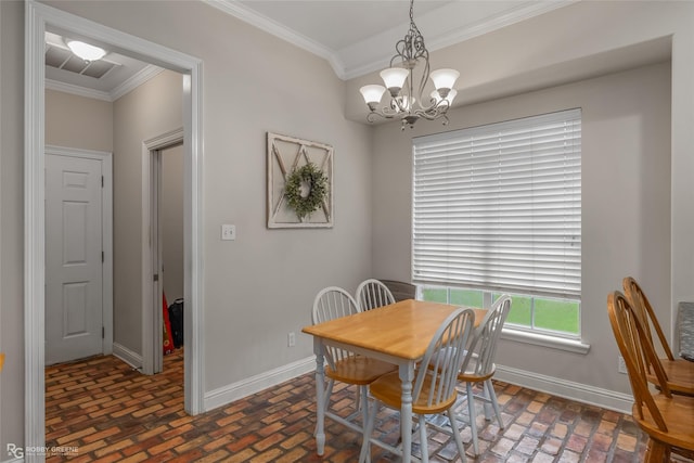 dining room featuring crown molding and a chandelier