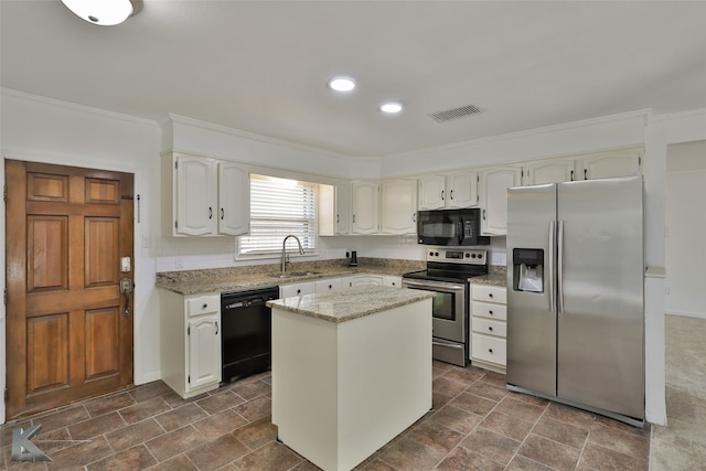 kitchen with white cabinetry, sink, black appliances, light stone counters, and a center island