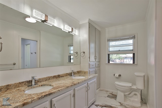 bathroom with vanity, toilet, and ornamental molding