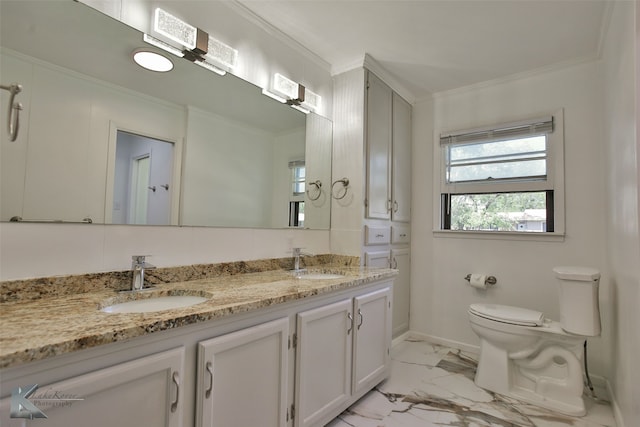 bathroom with vanity, toilet, and crown molding