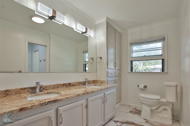 bathroom with ornamental molding, vanity, and toilet