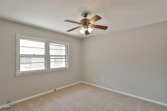 unfurnished room featuring ceiling fan and carpet floors