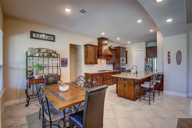 tiled dining area with sink